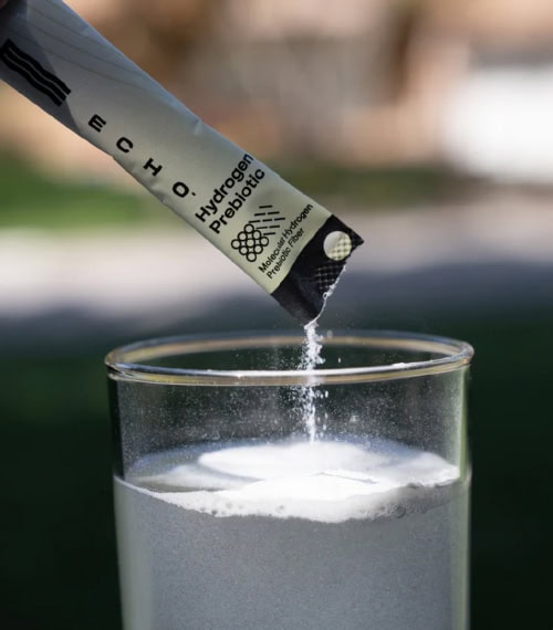 Image of Echo's Prebiotic being poured into a water glass.