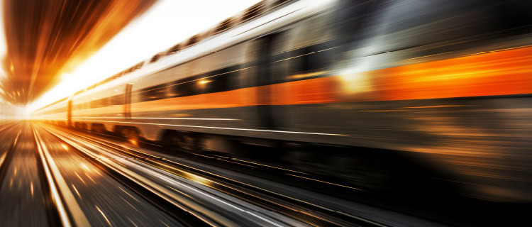 A blurred image of a speeding train.