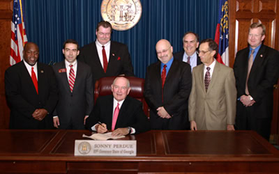 Signing of House Bill 451 with Sonny Perdue, Georgia’s governor.