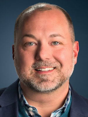 Headshot of John Partain, Chief Customer Officer, PCS Software.