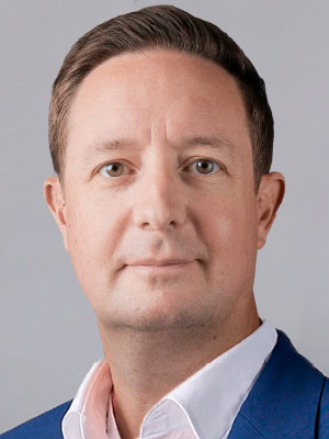 Headshot of Colin Chapman, Senior Vice President, Services, Flex.