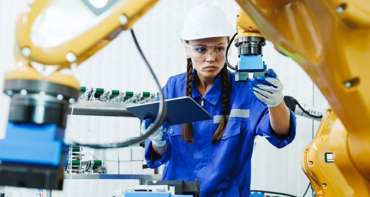 Image of a women at work in a manufacturing job.