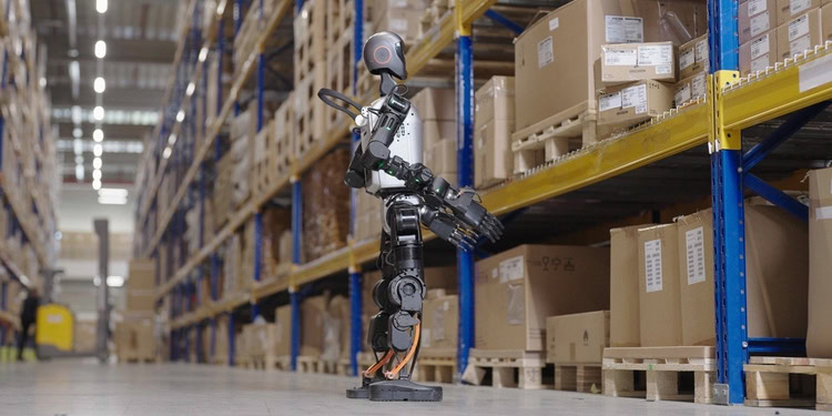 A humanoid robot checks for misplaced or improperly stacked items.