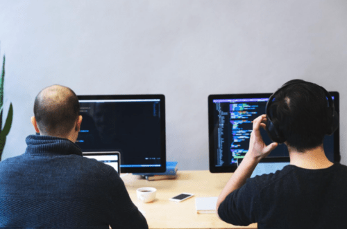 two people working at computers